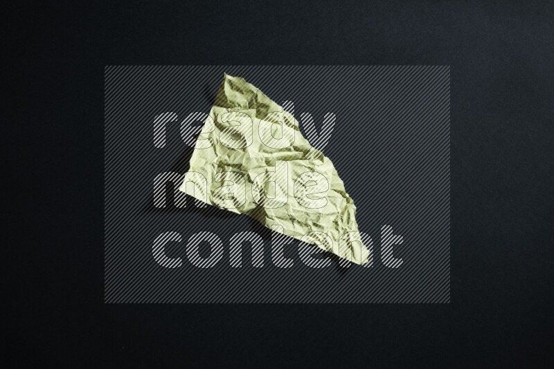 Yellow paper sheet on black background