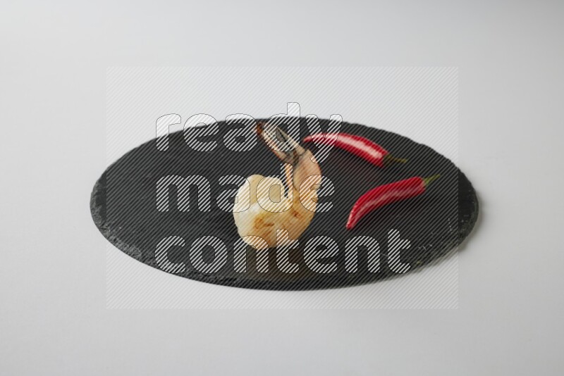 one  grilled shrimp  on a black slate direct  on a white back ground