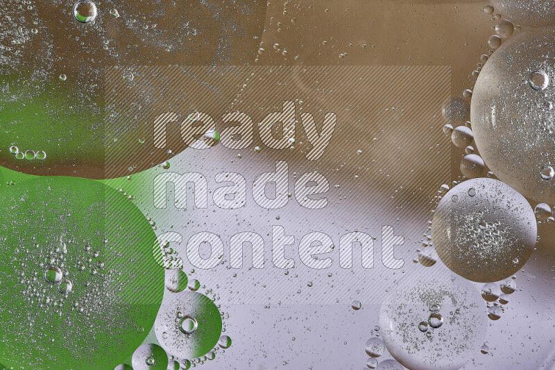 لقطات مقربة لفقاعات من الزيت على سطح الماء باللون البني والأخضر والأبيض